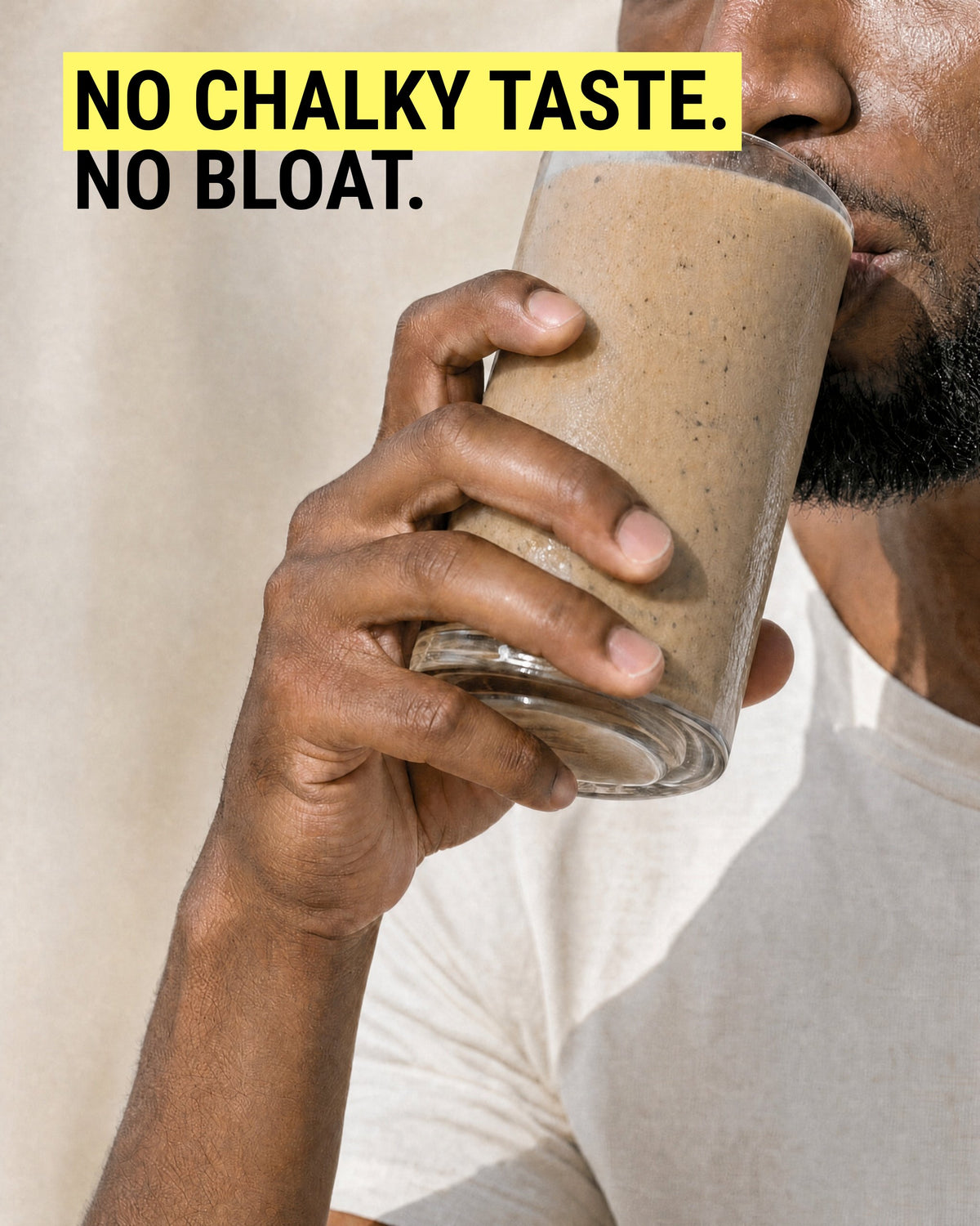 Man drinking a thick JOVA protein smoothie from a glass
